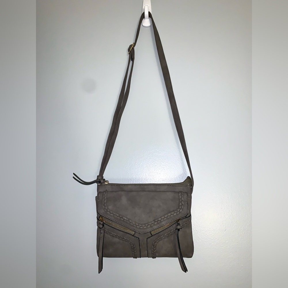 Charming Charlie’s cross body bag. Gray slim purse. Slightly used. Adjustable.